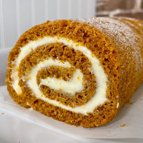 A pumpkin roll with cream cheese frosting, dusted with powdered sugar, from Rocco's Market & Deli.