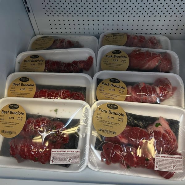 Packaged Rocco's Market & Deli beef and pork braciole in a refrigerated display case.